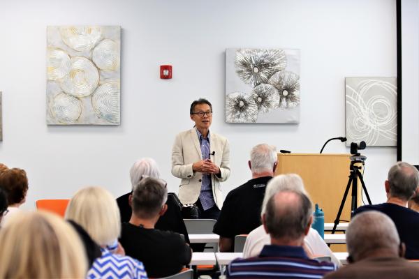 Dr. John Huang gives a presentation to participants of the Fall 2024 Donovan Forum Series in September 2024, at the Lexington Senior Center.